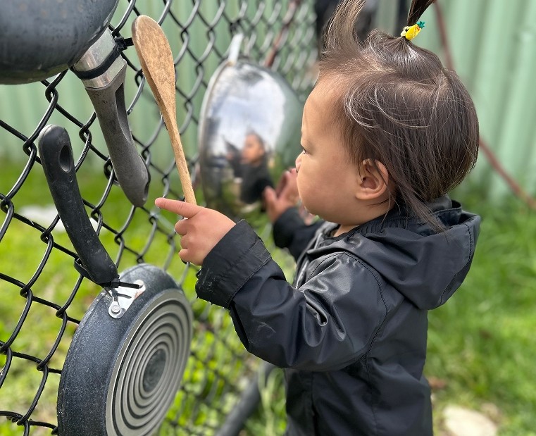 Toddler playing outdoors at ABC Day Nursery