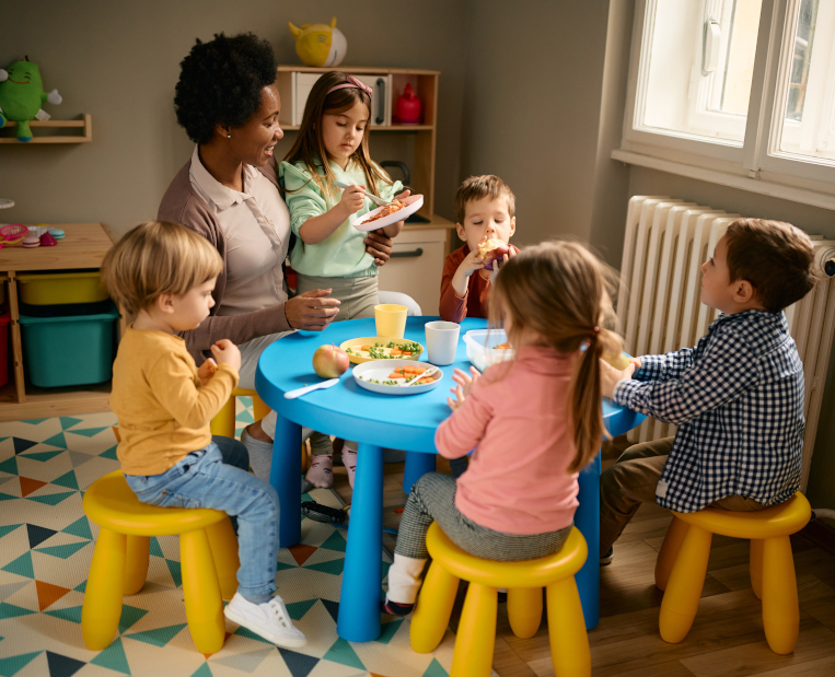 Children enjoying a meal together at ABC Day Nursery